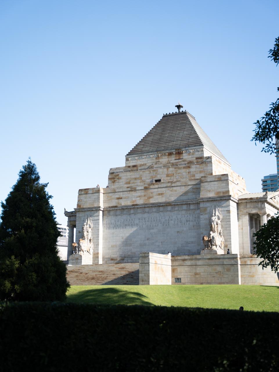 The Shrine of Remembrance seen across its sunlit lawns
