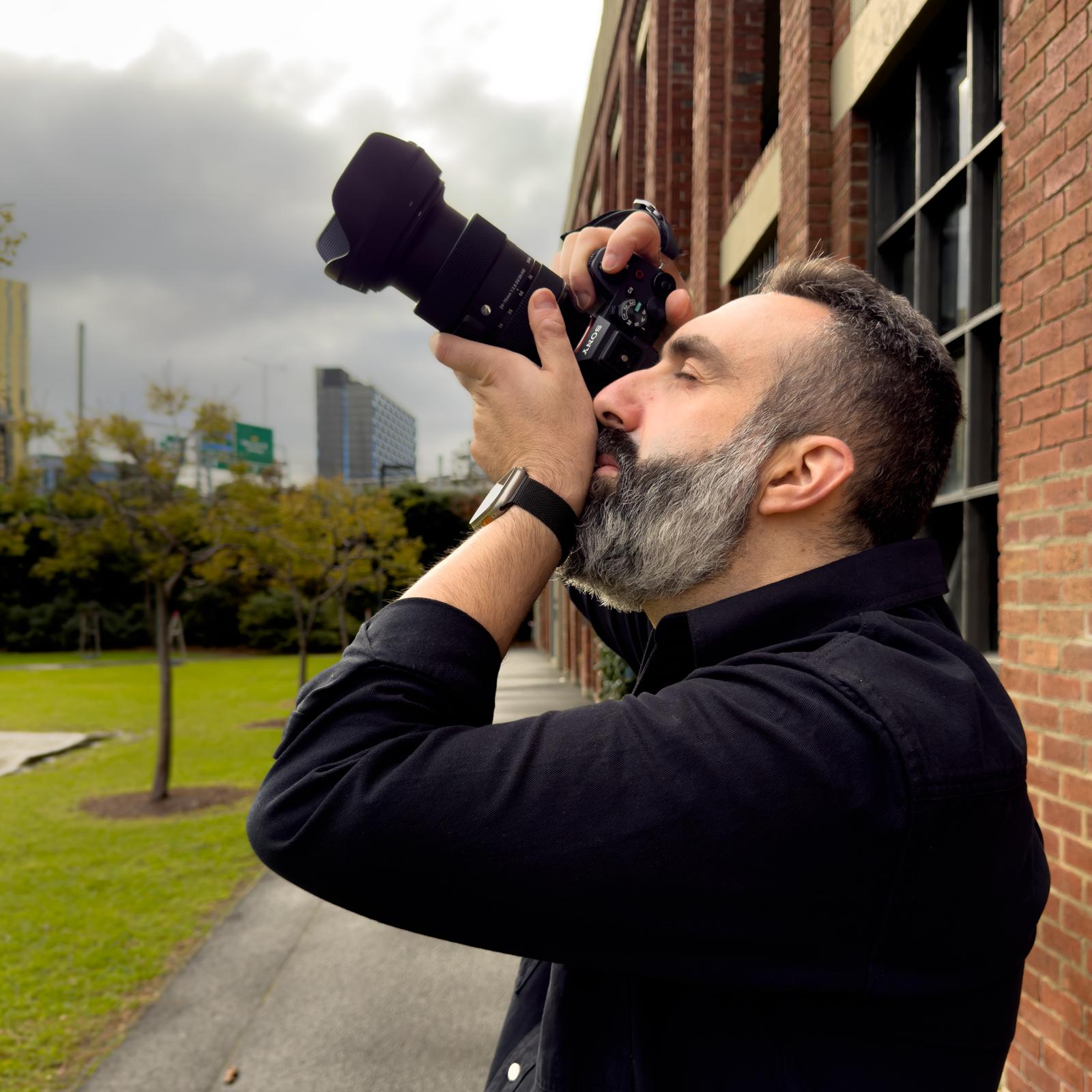 Marios Vogiatzis, founder of Nazare Media, holding his camera