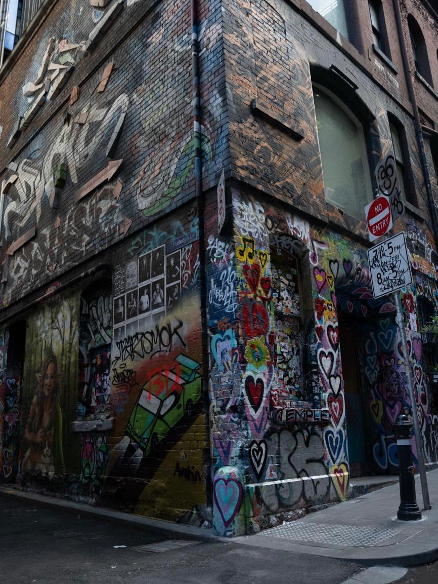 Graffiti-covered corner of Hosier Lane painted with hearts and murals