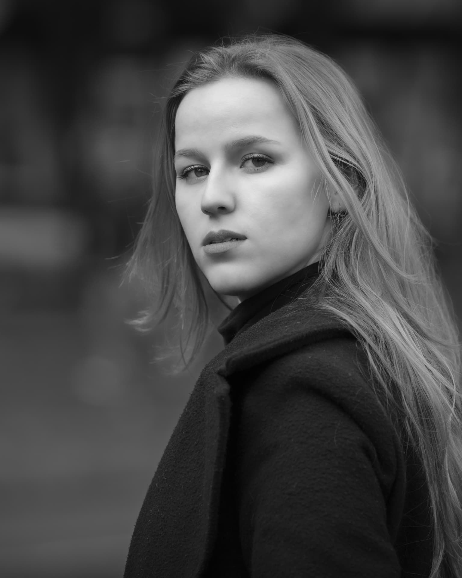 Black and white headshot of a woman with long blonde hair